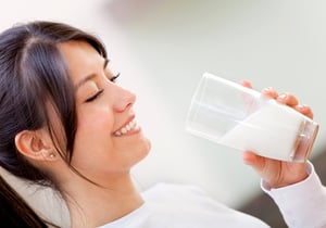 Beautiful woman drinking milk and then smiling-2