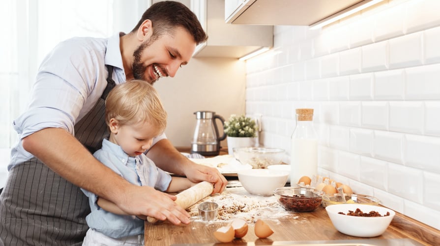 son and dad rolling dough