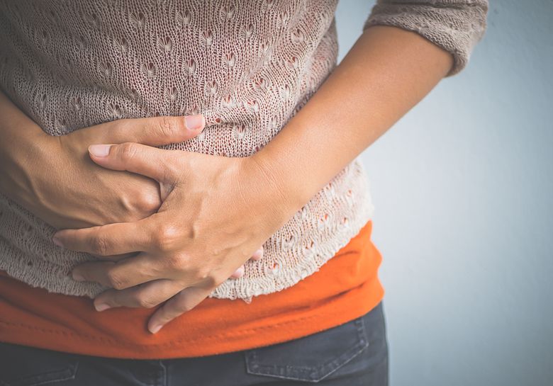 woman with stomach discomfort